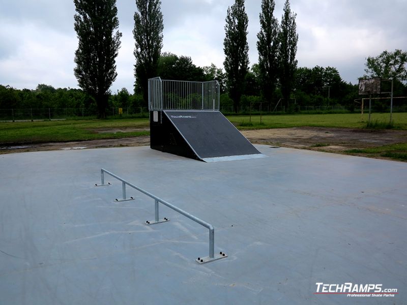 Grindbench concreted and bank ramp in a background 